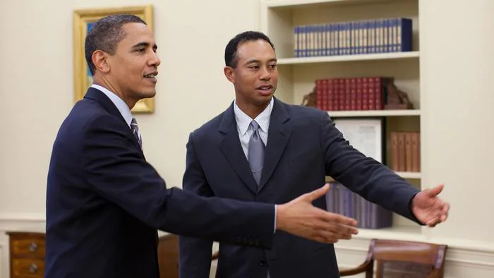 WASHINGTON - APRIL 20: In this handout released today by the White House, U.S. President Barack Obama (L) talks with professional golfer Tiger Woods in the Oval Office of the White House on April 20, 2009 in Washington, DC. The 14-time major winner visited the White House Monday following a press conference for the AT&T National, the PGA Tour event Woods hosts at the Congressional Country Club June 29-July 5. (Photo by Pete Souza/White House via Getty Images)