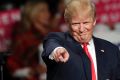 Republican presidential candidate Donald Trump acknowledges the crowd before speaking at Macomb Community College, ...