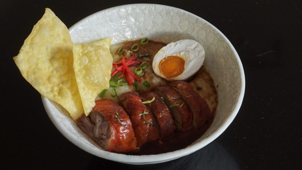 Roast duck and ginger congee with deep-fried wonton wrappers.