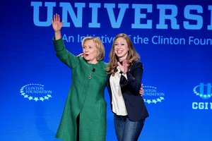 Former Secretary of State Hillary Rodham Clinton, left, and Chelsea Clinton wave at a university conference sponsored by their Clinton Global Initiative at the University of Miami, Saturday, March 7, 2015, in Coral Gables, Fla.