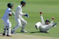 Shaun Marsh catches Temba Bavuma on day one of the first Test at the WACA.