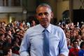 President Barack Obama takes to the stage at a Hillary Clinton rally in Columbus, Ohio on Tuesday.