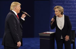 Republican presidential nominee Donald Trump and Democratic presidential nominee Hillary Clinton speak during the second presidential debate at Washington University in St. Louis, Sunday, Oct. 9, 2016.