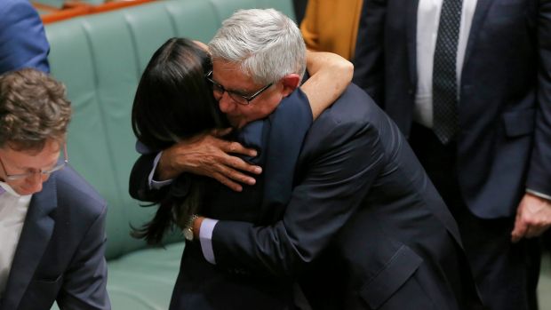 Liberal MP Ken Wyatt hugs Labor MP Linda Burney following her maiden speech.