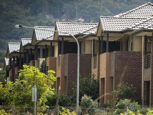 Townhouses stand in Sydney, Australia, on Tuesday, June 28, 2011. Australian home prices surged in the past two years, leaving the nation with the developed world's costliest homes, highest interest rates and among its most indebted households. Photographer: Ian Waldie/Bloomberg