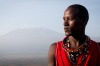 A Maasai warrior stands in his homeland as Africa's tallest mountain, the snow-capped Mt Kilimanjaro, stands in the ...