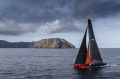 Plane sailing: Comanche rounds Tasman Island on the way to victory in the Sydney to Hobart.