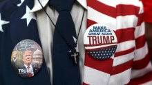 A Donald Trump supporter wearing US flag jacket