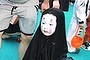 Momo as No-Face from <i>Spirited Away</i>.