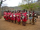 Swazi people dancing in a cultural village show.