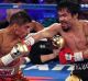 Fight night: Jessie Vargas and Manny Pacquiao battle in the third round.