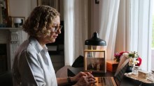 Playwright Joanna Murray-Smith working on a laptop in her study.