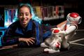 Grade 4 student Romy Szmulewicz with robot Rosie at the Biallik College. 