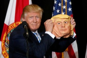 Donald Trump holding mask (ABC News)