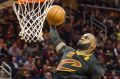 LeBron James dunks against the Knicks.