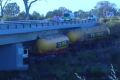 A truck crashed through the barrier on Kwinana Freeway and into a stream.