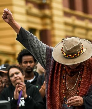 Best Picture Gallery, photo by Justin McManus. An Aboriginal woman raises her fist in defiance after speaking out ...