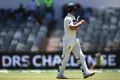 Australia's Mitchell Marsh leaves the field after a DRS challenge gave him out LBW on the fifth day of the first test.