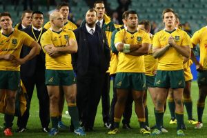 SYDNEY, AUSTRALIA - JUNE 25: Wallabies coach Michael Cheika and Wallabies players look dejected after losing the ...