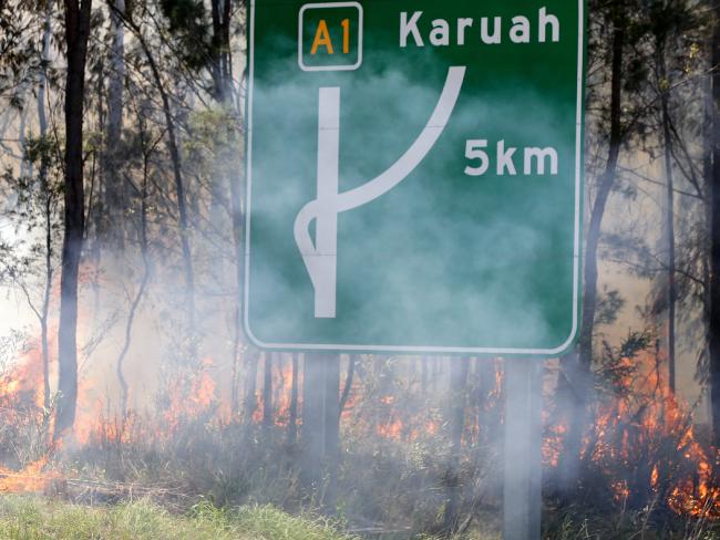 The fire along the Pacific Highway as it heads for Karuah. Picture: Peter Lorimer.