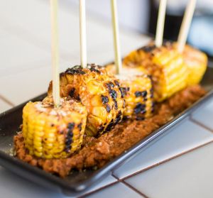 Corn on the cob with chipotle sauce.