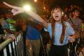 Newly elected Hong Kong lawmaker Yau Wai-ching, shouts at police officers after clashing as thousands of people march in ...
