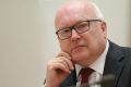 Attorney-General George Brandis maintains the new restrictions are legal.
