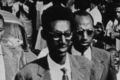 Rwanda Kigeli V Ndahindurwa (front) escorted through a town, c1959.
