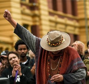 Best Picture Gallery, photo by Justin McManus. An Aboriginal woman raises her fist in defiance after speaking out ...