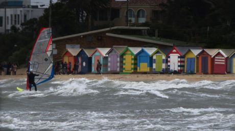 Windy weather in Melbourne brings out the kite boarders and wind surfers at Brighton Beach.