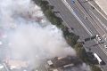 A "suspicious" grass fire at Bracken Ridge threatened nearby homes on Sunday afternoon.