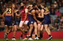 PERTH, AUSTRALIA - JUNE 30: Patrick McGinnity of the Eagles is congratulated by team mates after kicking a goal as ...