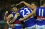 MELBOURNE, AUSTRALIA - SEPTEMBER 16:  Liam Picken and the bulldogs celebrate a goal during the AFL 2nd Semi Final match ...