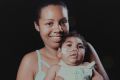 Tatiane do Nascimento holds her son Willamis Silva, who was born with microcephaly, as a result of his mother's Zika ...