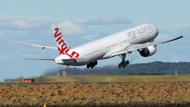 A radio hoaxer told a Virgin pilot to abort a landing.