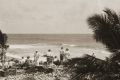 Islanders and members of the Emden watching the battle from the shore of Direction Island.