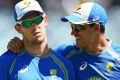 Mitch Marsh and Mitchell Starc warm up before the start of play on day three.