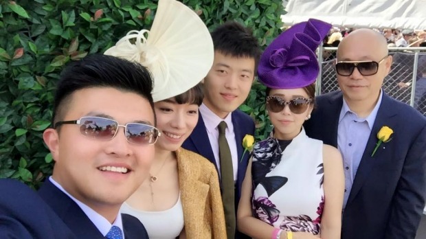 Andrews government adviser Mike Yang (left) with Tian Di (right) and Sisly Tian (second from right) at the Spring Racing Carnival last year.