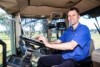 Field controls engineer, Julian Hall, in a tractor with his laptop. 