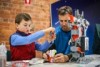 Henry, 7, with his father and mentor Julian Hall building a robot which will then be programmed to move.