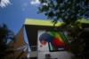 A painting of a rainbow lorikeet on the side of a building.