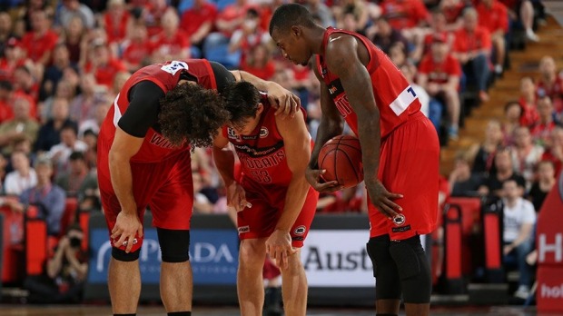 Damian Martin after he injured his knee in Saturday's win over the Adelaide 36ers.