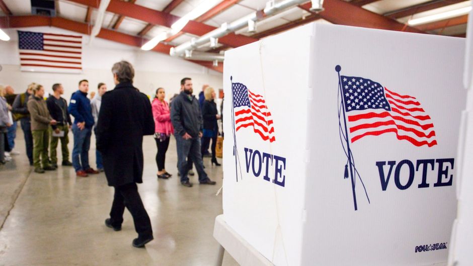 Voters line up by precinct to get their ballots on Election Day at the Latah County Fairgrounds in Moscow, Idaho.