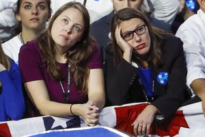 Guests watch early results during Democratic presidential nominee Hillary Clinton's election night rally in the Jacob Javits Center glass enclosed lobby in New York, Tuesday, Nov. 8, 2016.