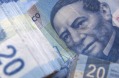 The Mexican peso sank 7.7 per cent to 19.7367 per dollar in morning trading in New York