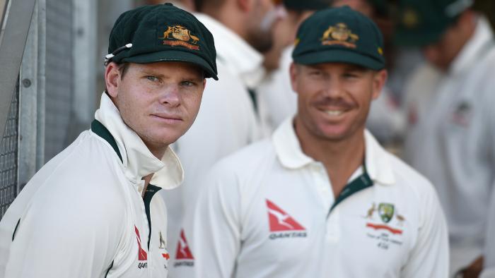 David Warner looks on to Australian captain Steve Smith prior to play on day 1 of the second Test Match between Australia and New Zealand at the Hagley Oval in Christchurch, Saturday, Feb. 20, 2016. (AAP Image/Dave Hunt) NO ARCHIVING, EDITORIAL USE ONLY, IMAGES TO BE USED FOR NEWS REPORTING PURPOSES ONLY, NO COMMERCIAL USE WHATSOEVER, NO USE IN BOOKS WITHOUT PRIOR WRITTEN CONSENT FROM AAP