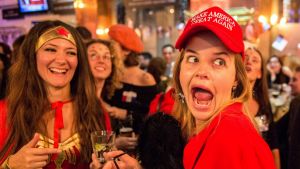 A Democrat wearing a 'Make America Great Again' hat and her friend dressed as Wonder Woman were celebating when Hillary ...