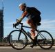 A cyclist against the backdrop of Sydney's Barangaroo. 