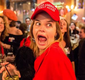 LONDON, ENGLAND - NOVEMBER 08: A Democrat wearing a 'Make America Great Again' hat and her friend dressed as Wonder ...