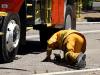 Tony Abbott falls off fire truck